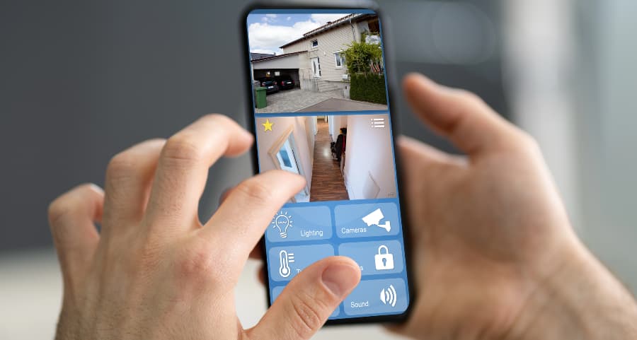 Homeowner checking video camera streams on a smartphone